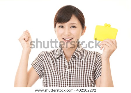 Smiling young woman with wallet