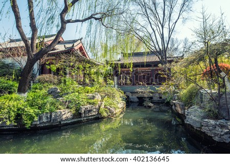 Chinese style park well-known as 'baotuquan park' with natural spring water and ancient pavilion -Jinan, China Royalty-Free Stock Photo #402136645