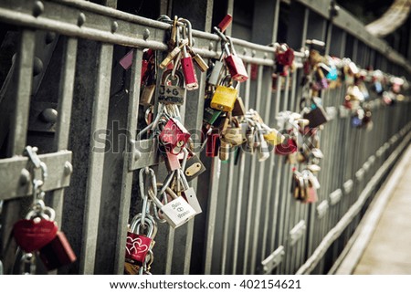 Love locks on the metallic fence. Lovers theme.