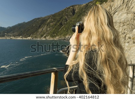 Photographer woman with camera outdoors