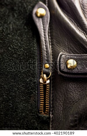ajar the zipper on a leather bag