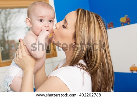 A picture of happy mother with adorable baby
