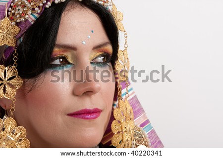 Portrait of a Young woman in traditional arabic gown looking away