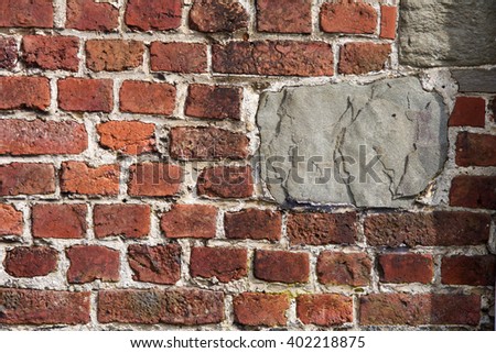 Old textured brick wall with quarry stone