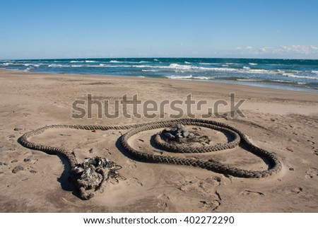Abandoned rope in the sand