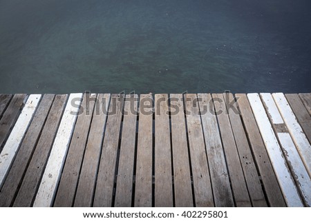 Wooden walkway in tranquil lake