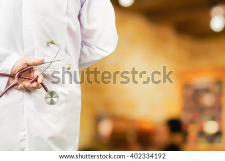 male doctor holding a stethoscope in a hospital,medical students during the conference,Health Check with digital system support for patient,test results and patient registration,selective focus
