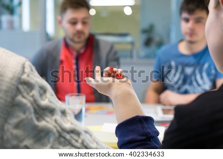 Business Discussion at grey Table in Office Meeting Room young People Men and Woman pointing convincing Opponents focus on Hand