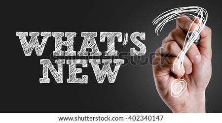 Hand writing the text: Whats New? Royalty-Free Stock Photo #402340147