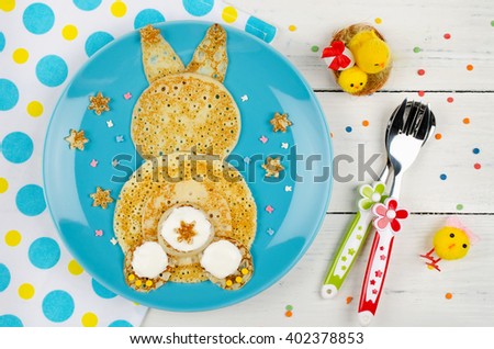 Funny bunny pancakes on the plate. Creative breakfast for kids. Top view