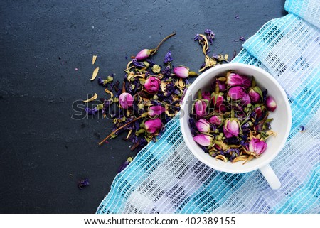 Assortment of dry herbal tea over slate background (Tea)