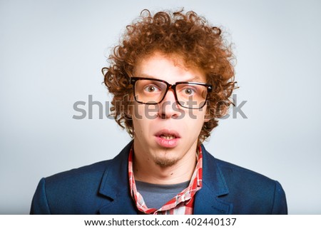 closeup curly amazed man isolated on a background
