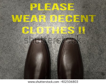 Business brown shoes on floor with text :Please wear decent clothes!!