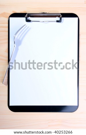 The shade falls from fork on Blank clipboard and gives the chance to use photo in design for restaurants.