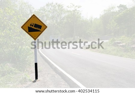  Traffic alerts downhill slope. Reduce speed and use a lower gear.  
