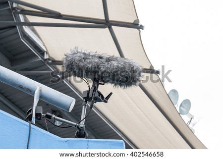 Big and furry sport microphone hold on stadium