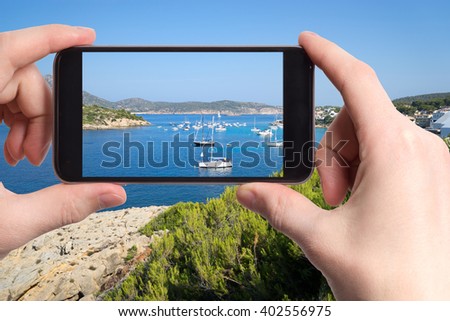 Snapshot of a beautiful seascape with white yacht on mobile phone
