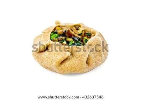 One round cheesecake carol from rye flour stuffed with mushrooms and parsley isolated on white background