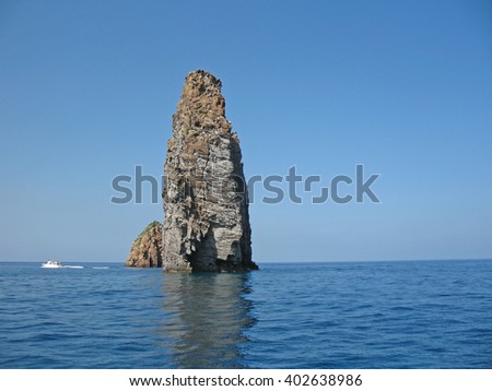  Cliffs on coastline of Lipari island, Sicily, Italy, July 2015. Royalty-Free Stock Photo #402638986