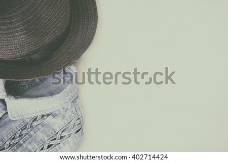 still life photography : Adventure hat and jeans background, women casual concept, vintage and retro style.
