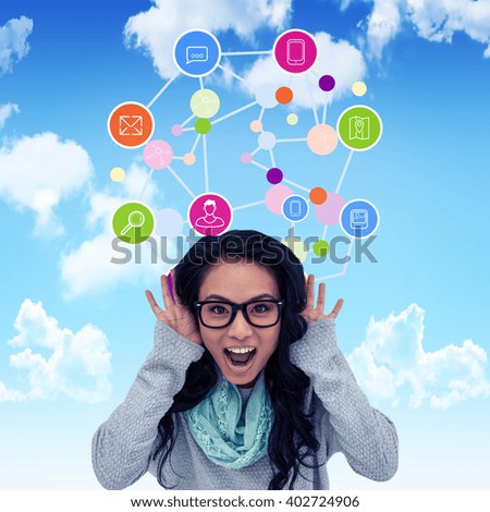 Asian woman shouting to the camera against blue sky