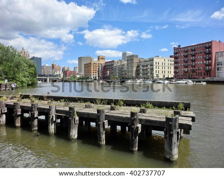 Downtown Milwaukee with dock across Kinnickinnic river - landscape color photo