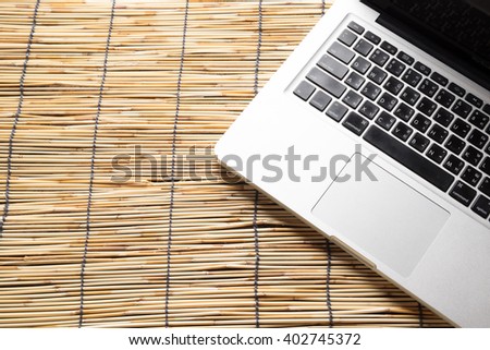 laptop with isolated screen on old wooden desk