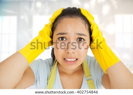 Stressed out woman against twinkling lights over room with windows