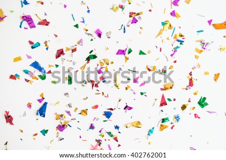 colourful sparlking confetti on white background Royalty-Free Stock Photo #402762001