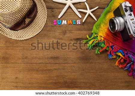 beach accessories on wooden board.
