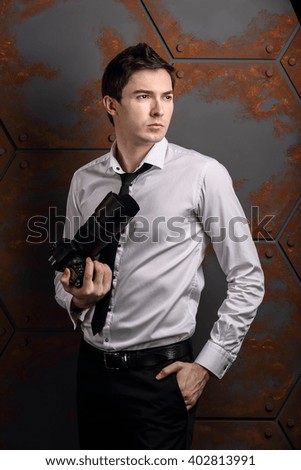 photo master in studio is posing for another photographer