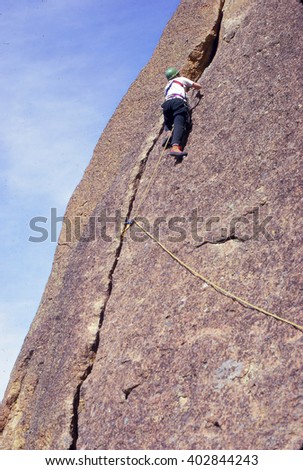 Climber on steep face of Spiderman climb, Smith Rock, Oregon