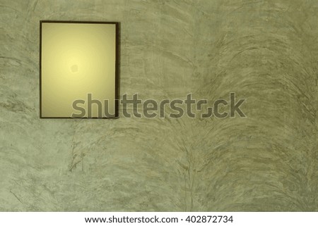 Picture frames on concrete wall