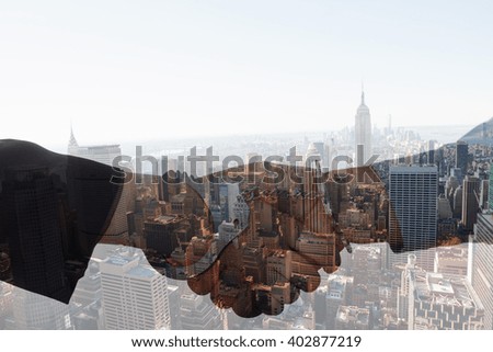 Business people in handcuffs shaking hands against new york skyline