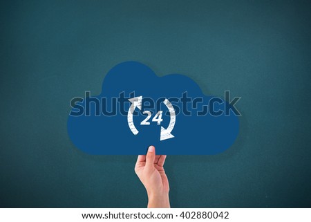 Hand holding cloud against teal, blue background