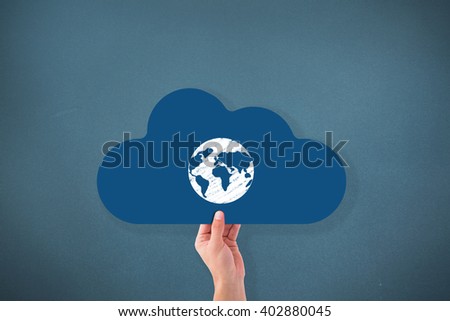Hand holding cloud against blue background