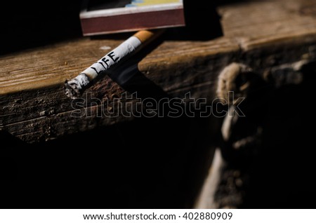 Cigarette with life written on the side