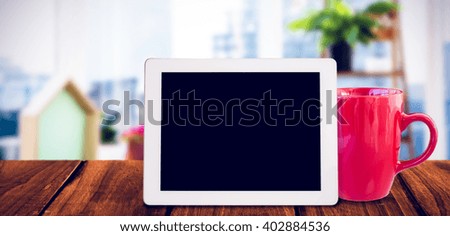 Tablet pc against view of a business desk