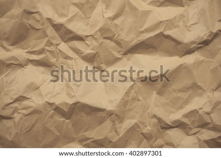 Textured obsolete crumpled packaging brown paper background