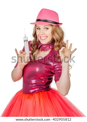 Dancing Blonde show girl holding syringe. Isolated over white background