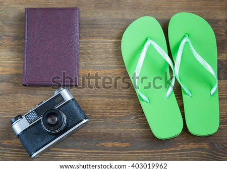 Vacation items on wooden table