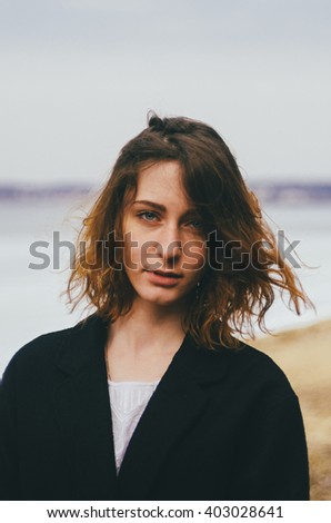 portrait of the young pretty girl on the beach