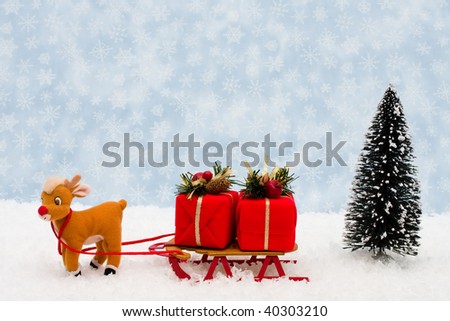 Evergreen trees sitting with a wooden sleigh with a blue snowflake background, Winter time