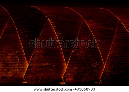 light and curve of red fire tube decoration.