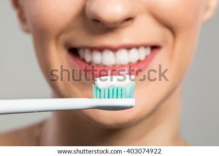 Ready for clening teeth, toothbrush and toothpaste close up Royalty-Free Stock Photo #403074922