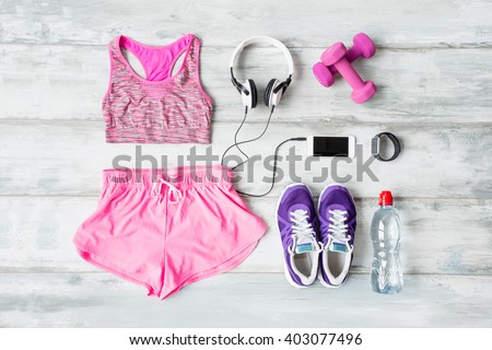 Workout objects on the floor  Royalty-Free Stock Photo #403077496