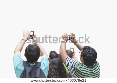 People taking pictures with cameras and mobile phones. Crowd of people taking photographs. Shoot picture