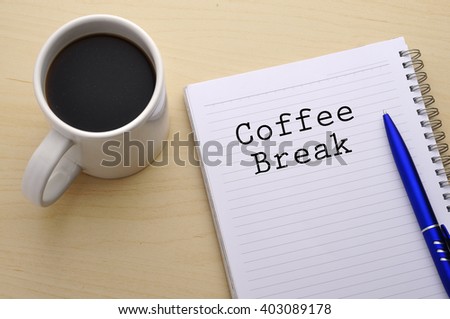 "Coffee Break" Word on Note Book with Cup of Coffee