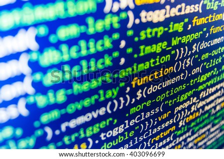   Developer working on program codes in office. Website development. Technology background.  Web site codes on computer monitor. Writing program code on computer. 
