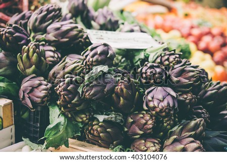 Artichokes on sale at one of the markets in Genova, Italy. Toned picture